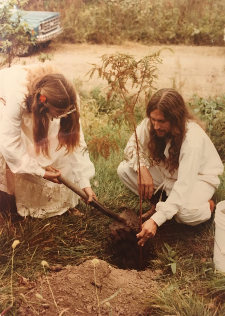 Patti and Reed planting a cyprus tree on their wedding day.